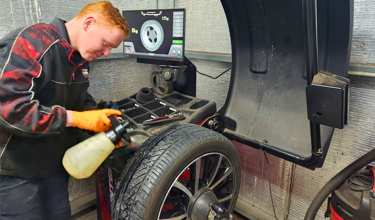 Mechanic balancing a wheel at Blackwood Dyno Tune & Service